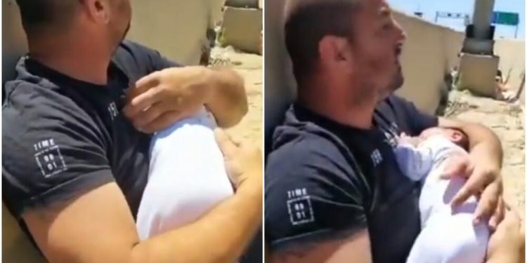 (VIDEO) OTAC DRŽI BEBU U NARUČJU DOK LETE RAKETE: Snimak opisuje sve užase sukoba na Bliskom istoku